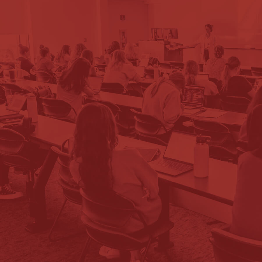 Students sitting in a classroom listening to a lecture.