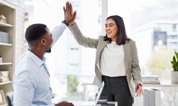 employees giving each other a high-five
