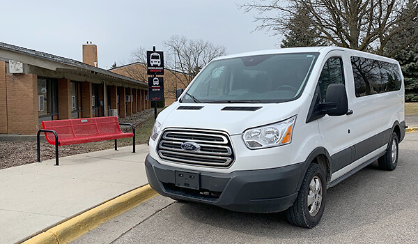 Shuttle bus to North Campus parked outside the visitor center
